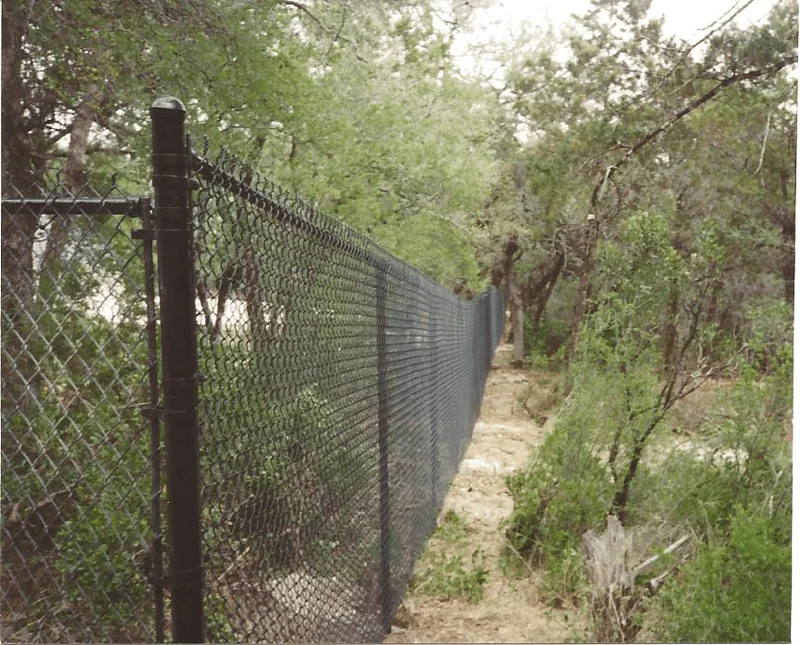Galvanized chain link fencing built by the B.C. Fence crew in Central Texas