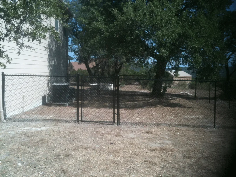 Chain link fence line completed by B.C. Fence on an Austin-area property