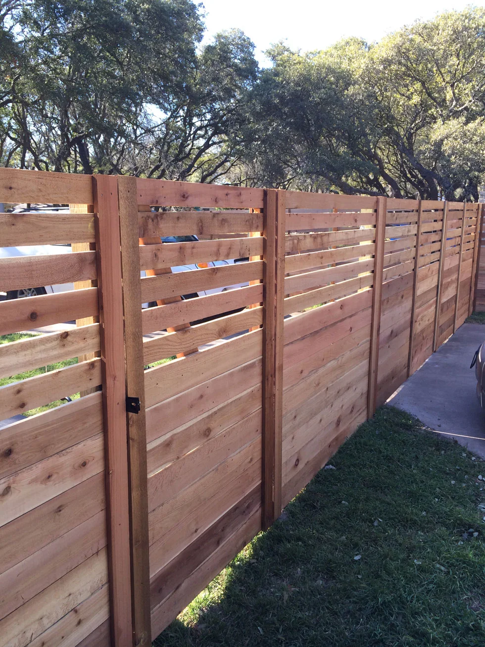 Gate and fence line completed by B.C. Fence on an Austin-area property
